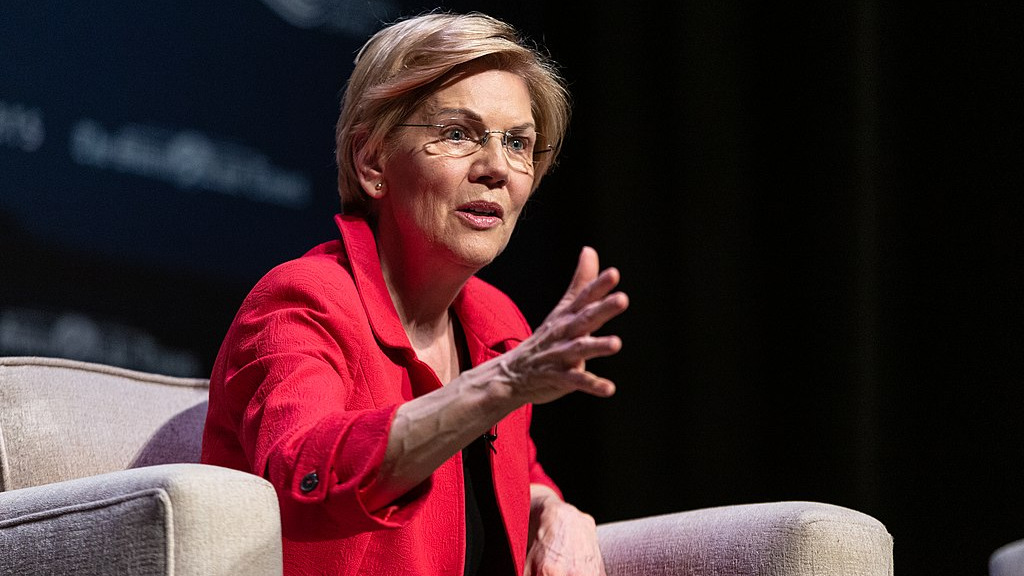Senator Elizabeth Warren speaking at an event, advocating for the IRS Direct File Program expansion, aimed at offering taxpayers a free and simplified tax-filing process.