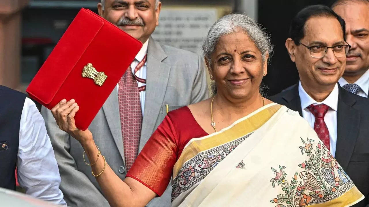 India’s Finance Minister Nirmala Sitharaman holding the budget briefcase during the presentation of the Union Budget 2025, symbolizing key tax reforms and investment measures.
